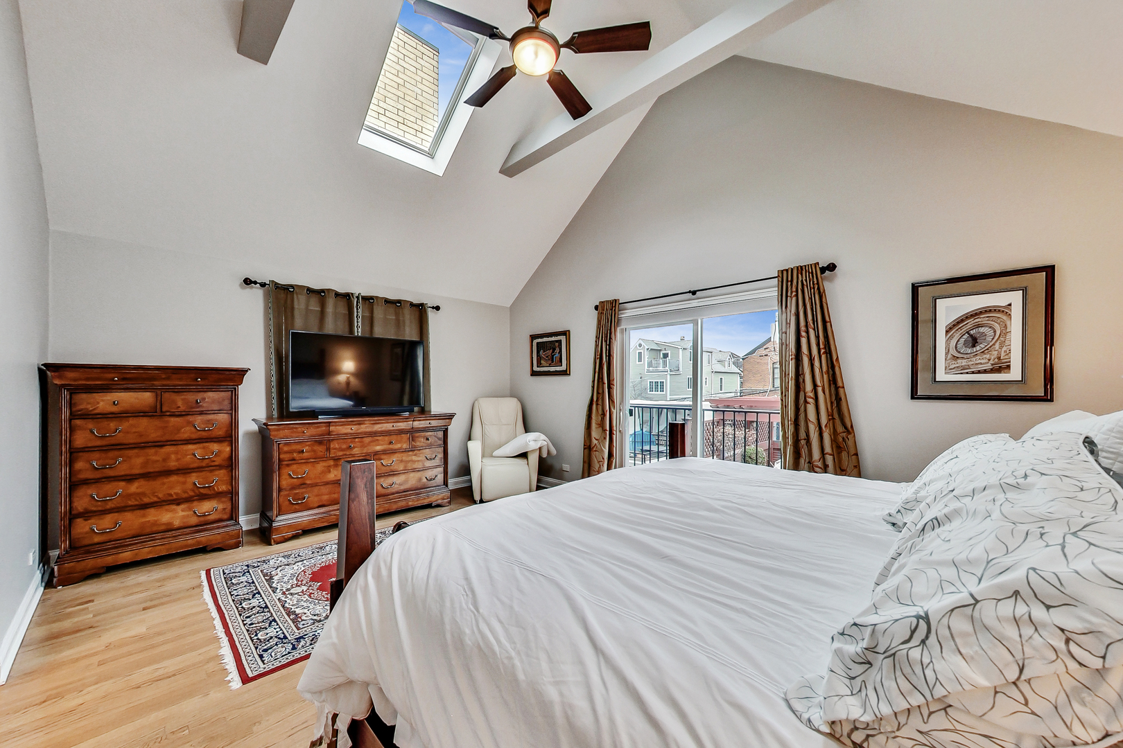 1508 West School Street Chicago, IL 60657 - Photo 15 of 40 a bedroom with a bed and a flat screen tv