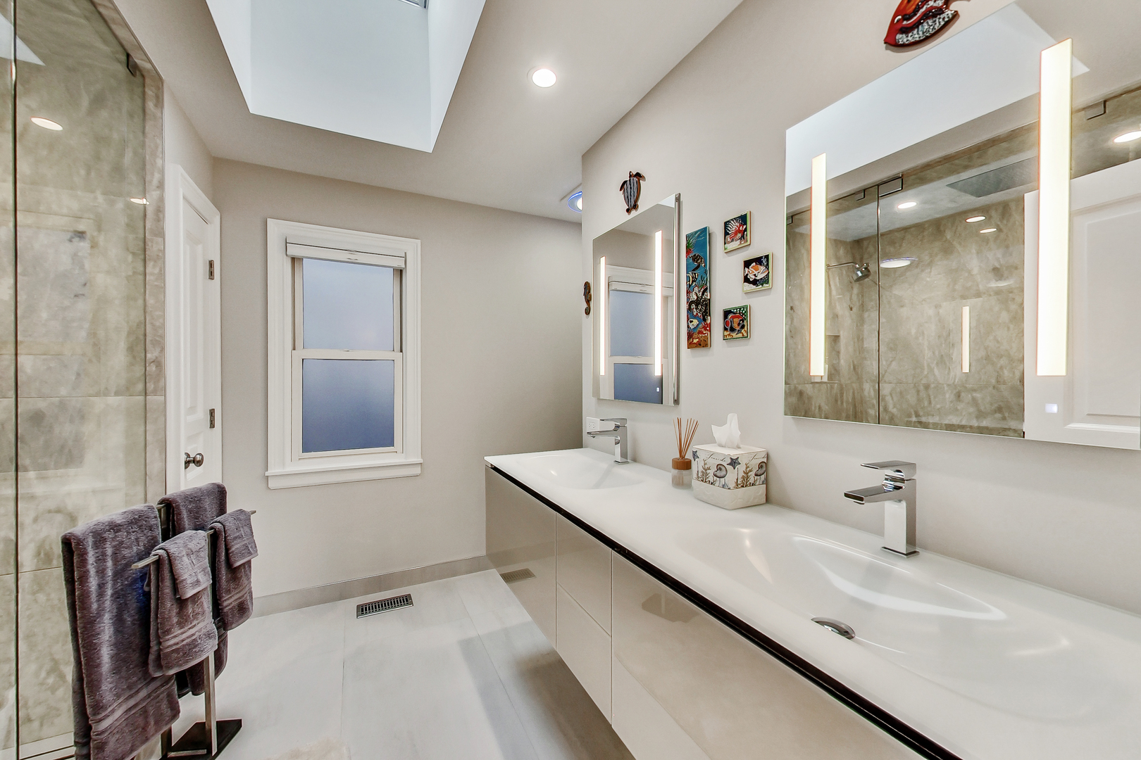 1508 West School Street Chicago, IL 60657 - Photo 16 of 40 a en suite bathroom with a double vanity sink a mirror and a shower