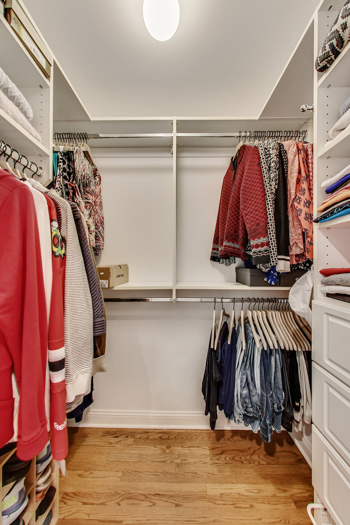 1508 West School Street Chicago, IL 60657 - Photo 20 of 40 a view of walk in closet with clothes and shoes
