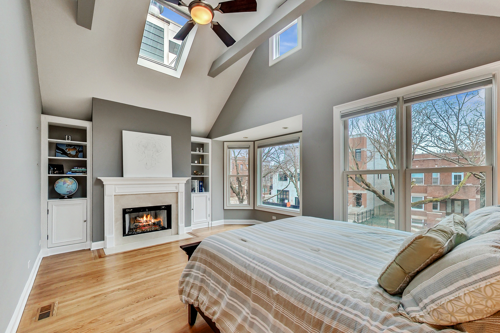 1508 West School Street Chicago, IL 60657 - Photo 22 of 40 a bedroom with a bed and a fireplace