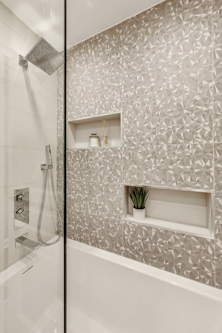 1508 West School Street Chicago, IL 60657 - Photo 24 of 40 a bathroom with a shower