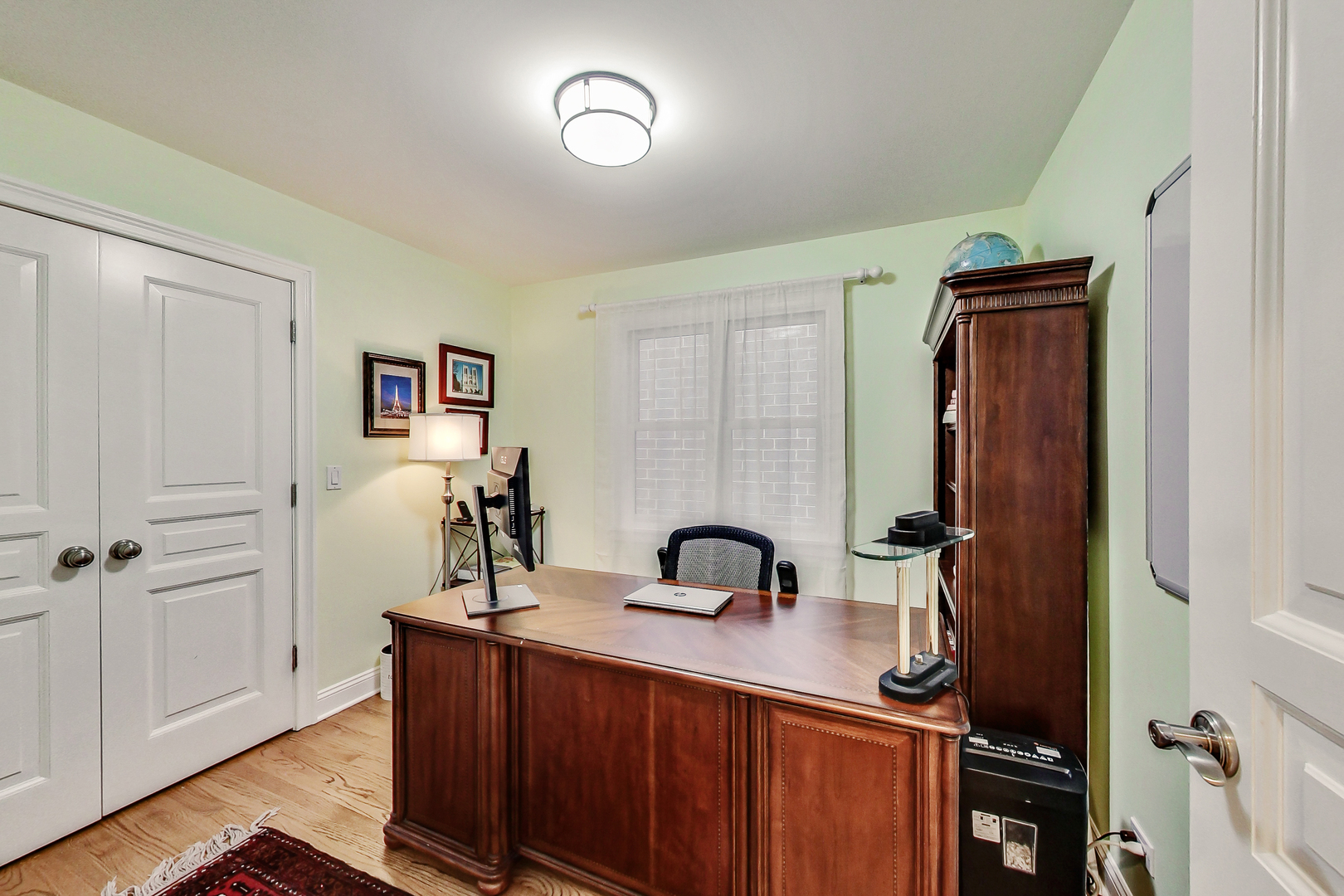 1508 West School Street Chicago, IL 60657 - Photo 25 of 40 a bathroom with a sink and a mirror