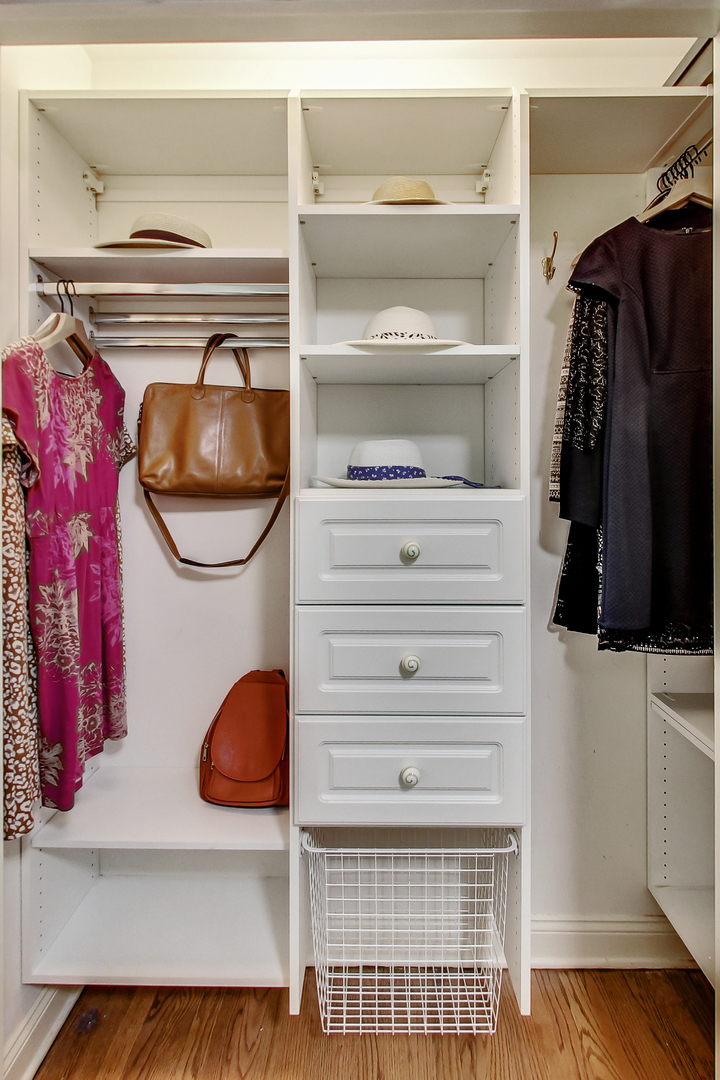 1508 West School Street Chicago, IL 60657 - Photo 26 of 40 a view of walk in closet with clothes and shoes