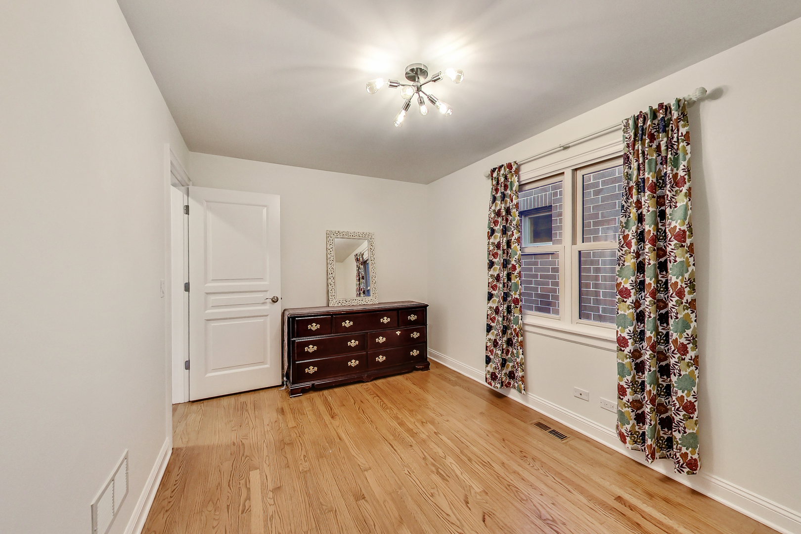 1508 West School Street Chicago, IL 60657 - Photo 27 of 40 wooden floor in an empty room with a window