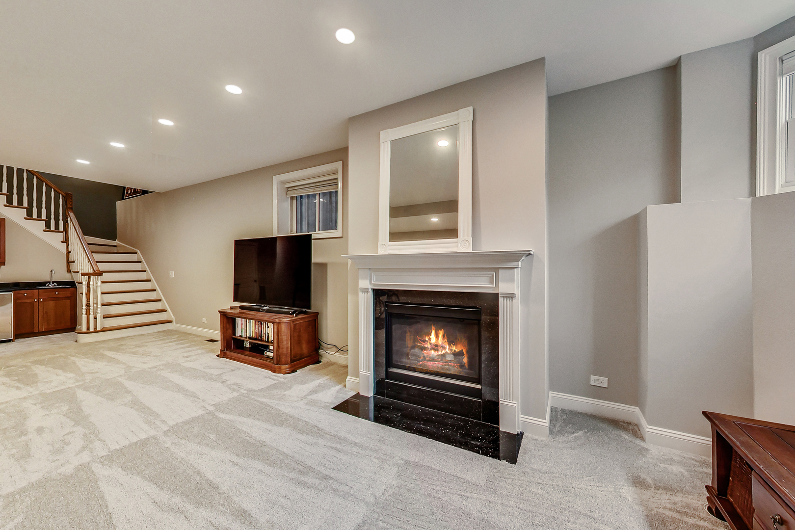 1508 West School Street Chicago, IL 60657 - Photo 31 of 40 a living room with furniture a flat screen tv and a fireplace