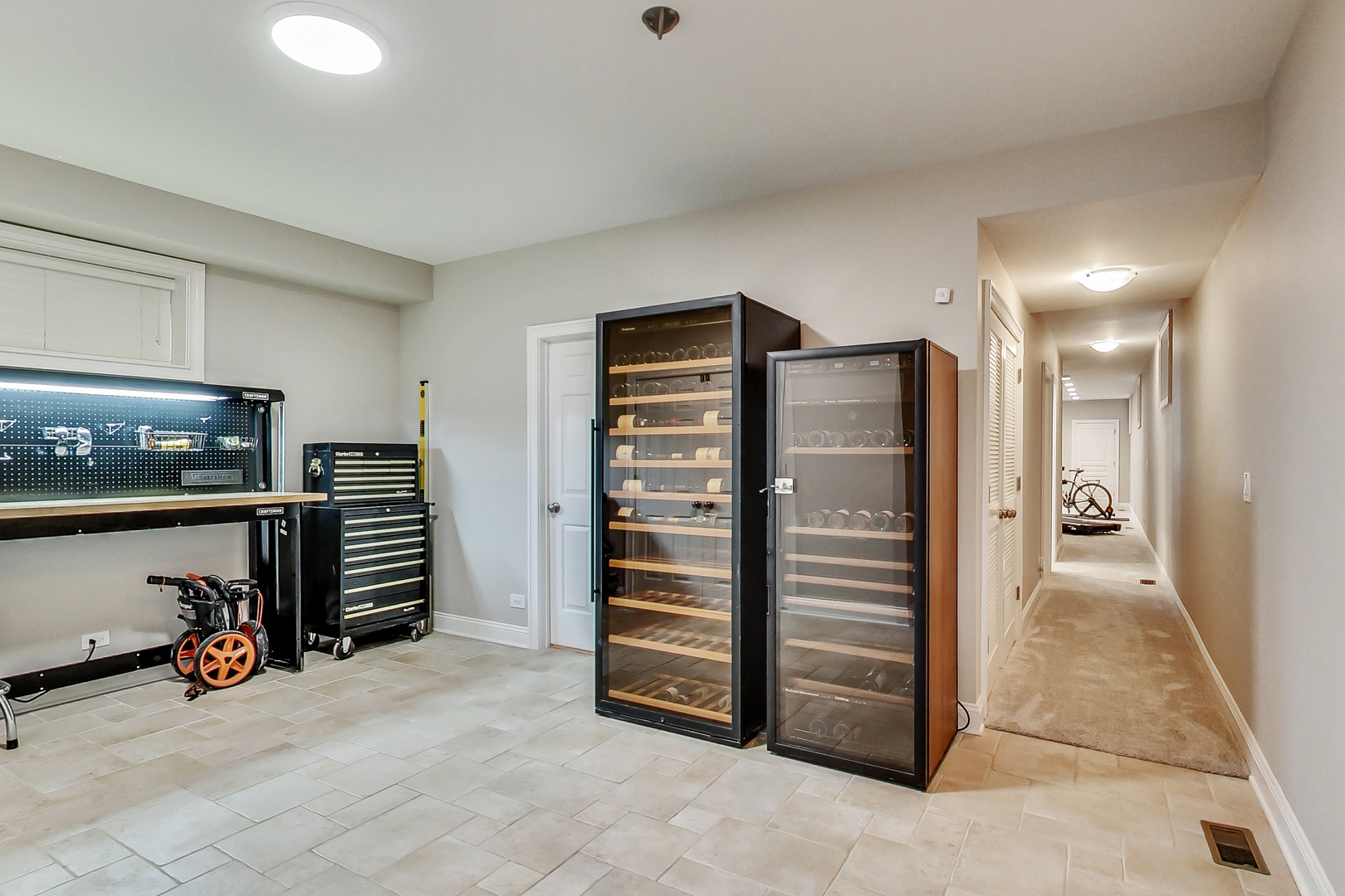 1508 West School Street Chicago, IL 60657 - Photo 35 of 40 a view of walk in closet with clothes