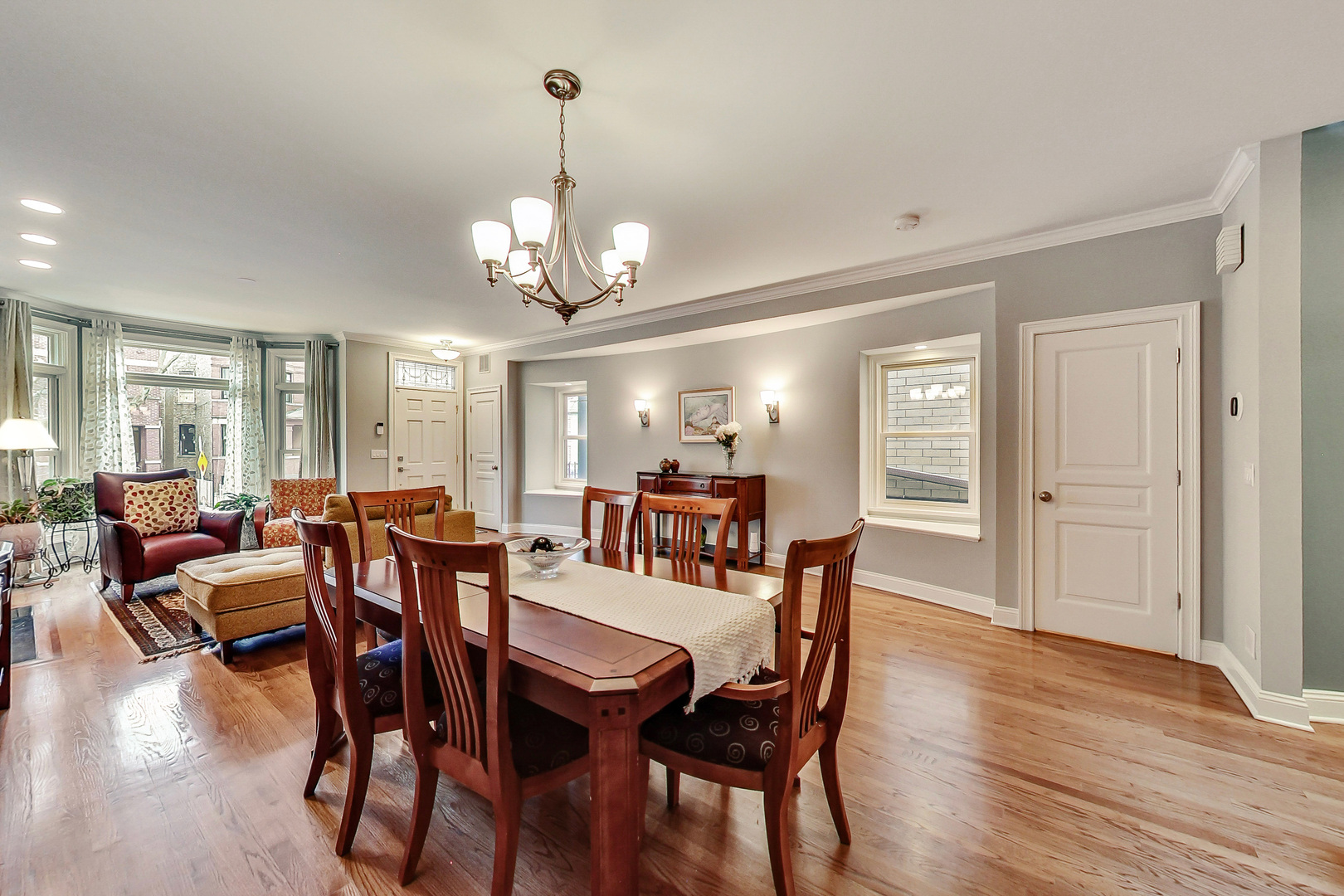 1508 West School Street Chicago, IL 60657 - Photo 4 of 40 a view of a dining room with furniture window and wooden floor
