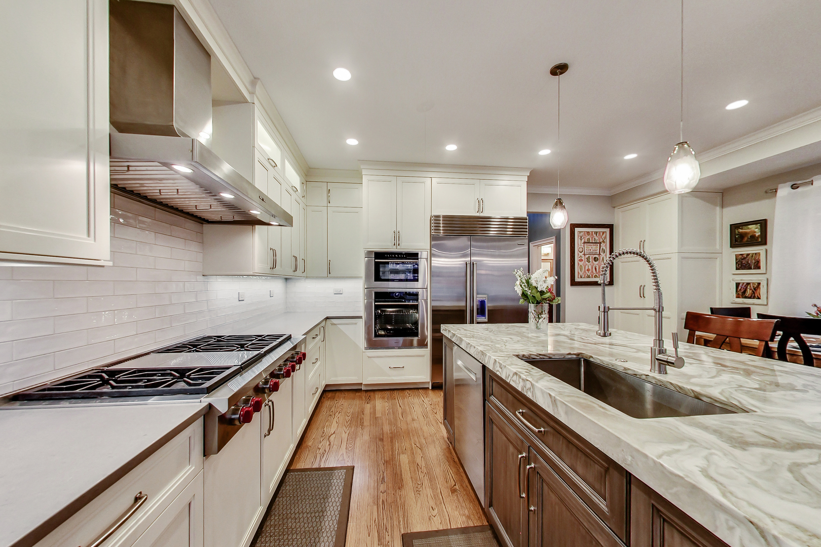 1508 West School Street Chicago, IL 60657 - Photo 8 of 40 a kitchen with stainless steel appliances granite countertop a sink stove and refrigerator