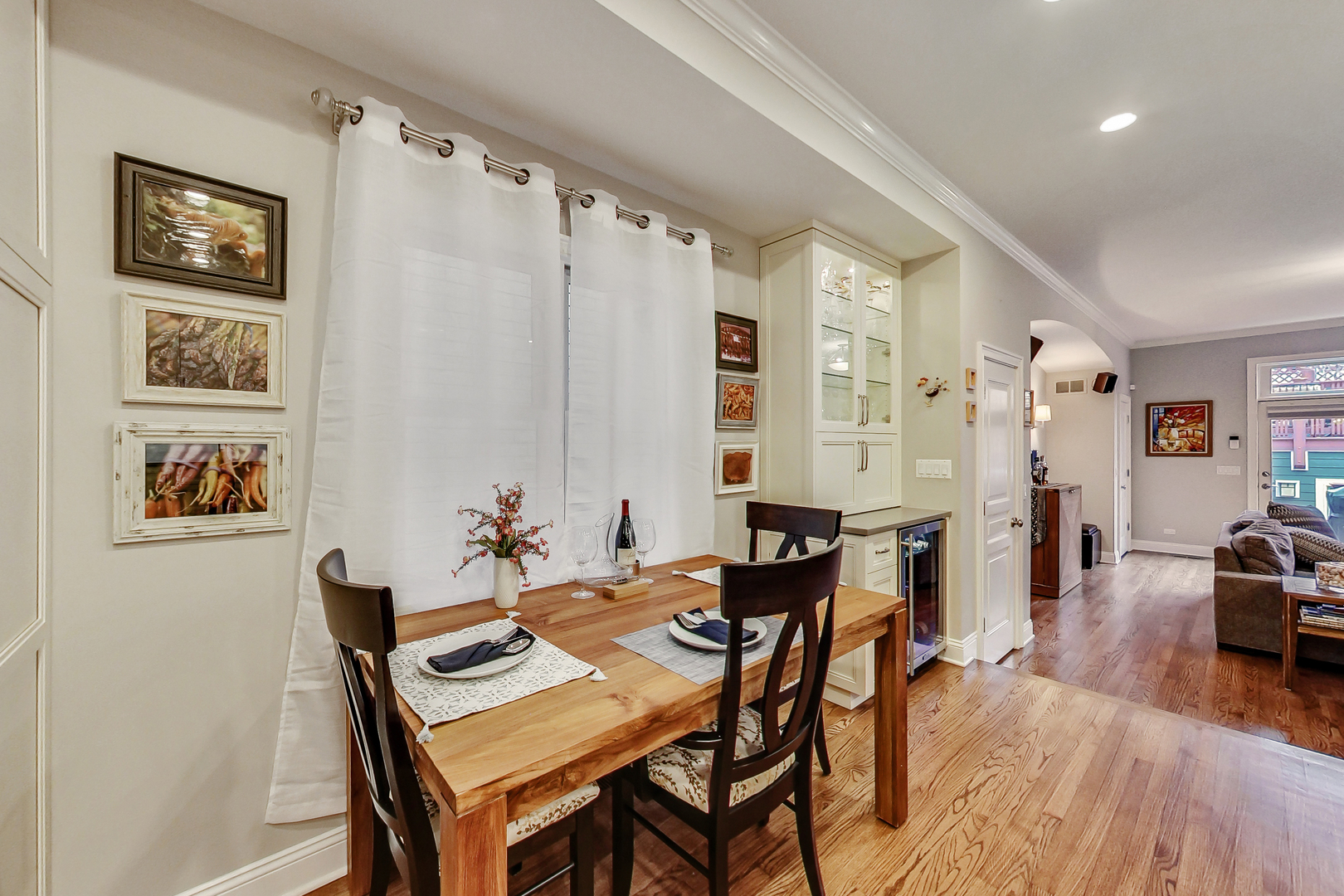 1508 West School Street Chicago, IL 60657 - Photo 9 of 40 a view of a dining room with furniture window and wooden floor