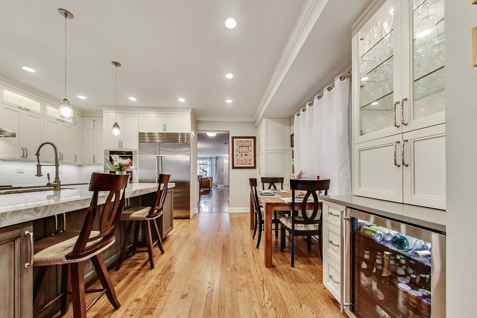 1508 West School Street Chicago, IL 60657 - Photo 10 of 40 a view of a dining room with furniture and wooden floor