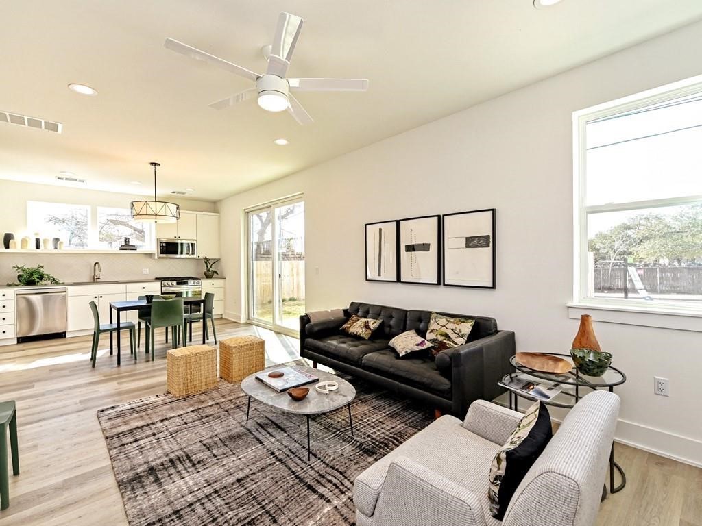 1116 Atkinson Road Austin, TX 78752 - Photo 1 of 1 a living room with furniture and a large window