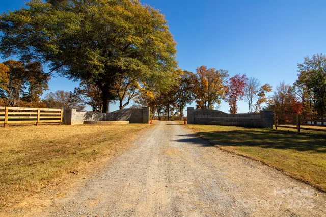 a view of a yard with swimming pool and an outdoor space