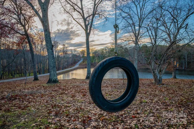 a view of a house with a backyard space and deck