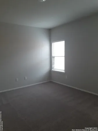 an empty room that has a window
