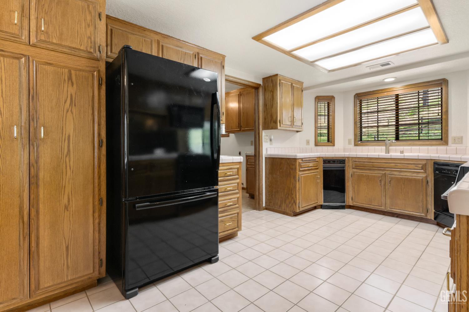 Undisclosed Address Tehachapi, CA 93561 - Photo 12 of 37 a kitchen with stainless steel appliances granite countertop a refrigerator and a sink