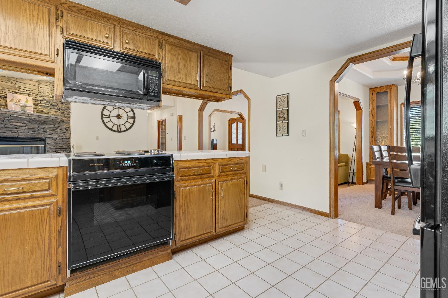 Undisclosed Address Tehachapi, CA 93561 - Photo 14 of 37 a kitchen with stainless steel appliances granite countertop a stove and a microwave