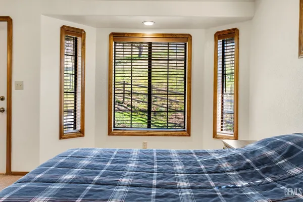 a spacious bathroom with a double vanity sink mirror and toilet