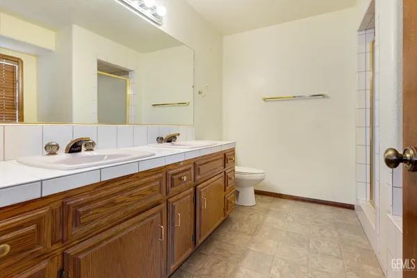 a bathroom with a bathtub and shower