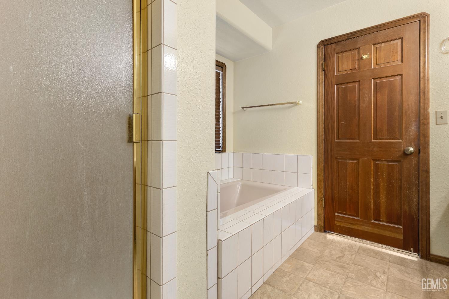 Undisclosed Address Tehachapi, CA 93561 - Photo 19 of 37 a bathroom with a bathtub and shower