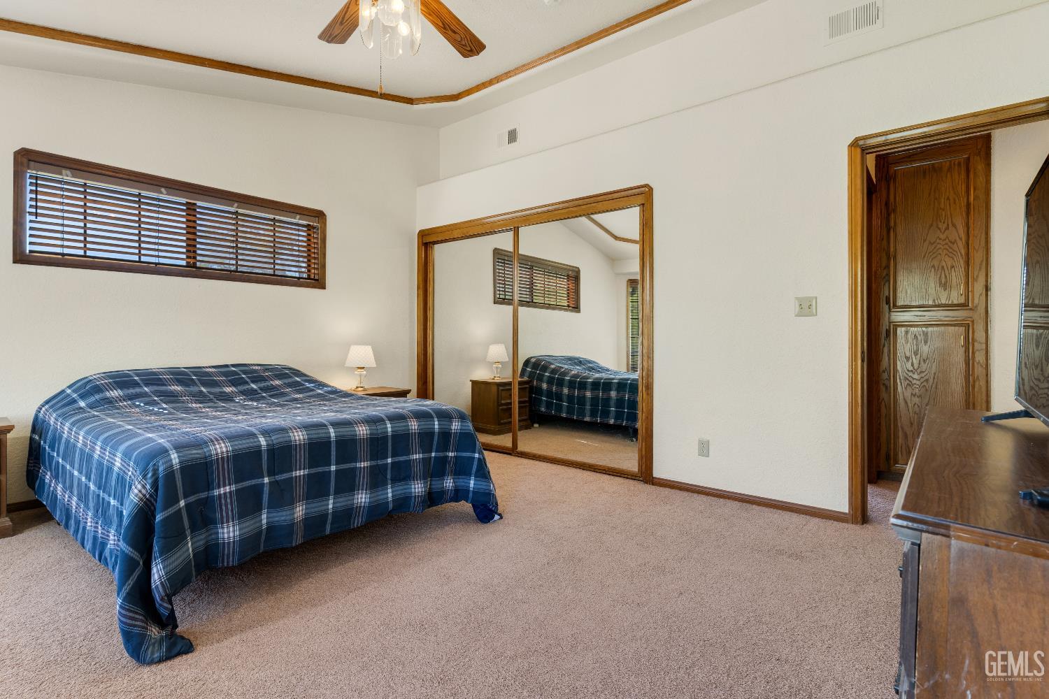 Undisclosed Address Tehachapi, CA 93561 - Photo 20 of 37 a spacious bedroom with a bed and a walk in closet