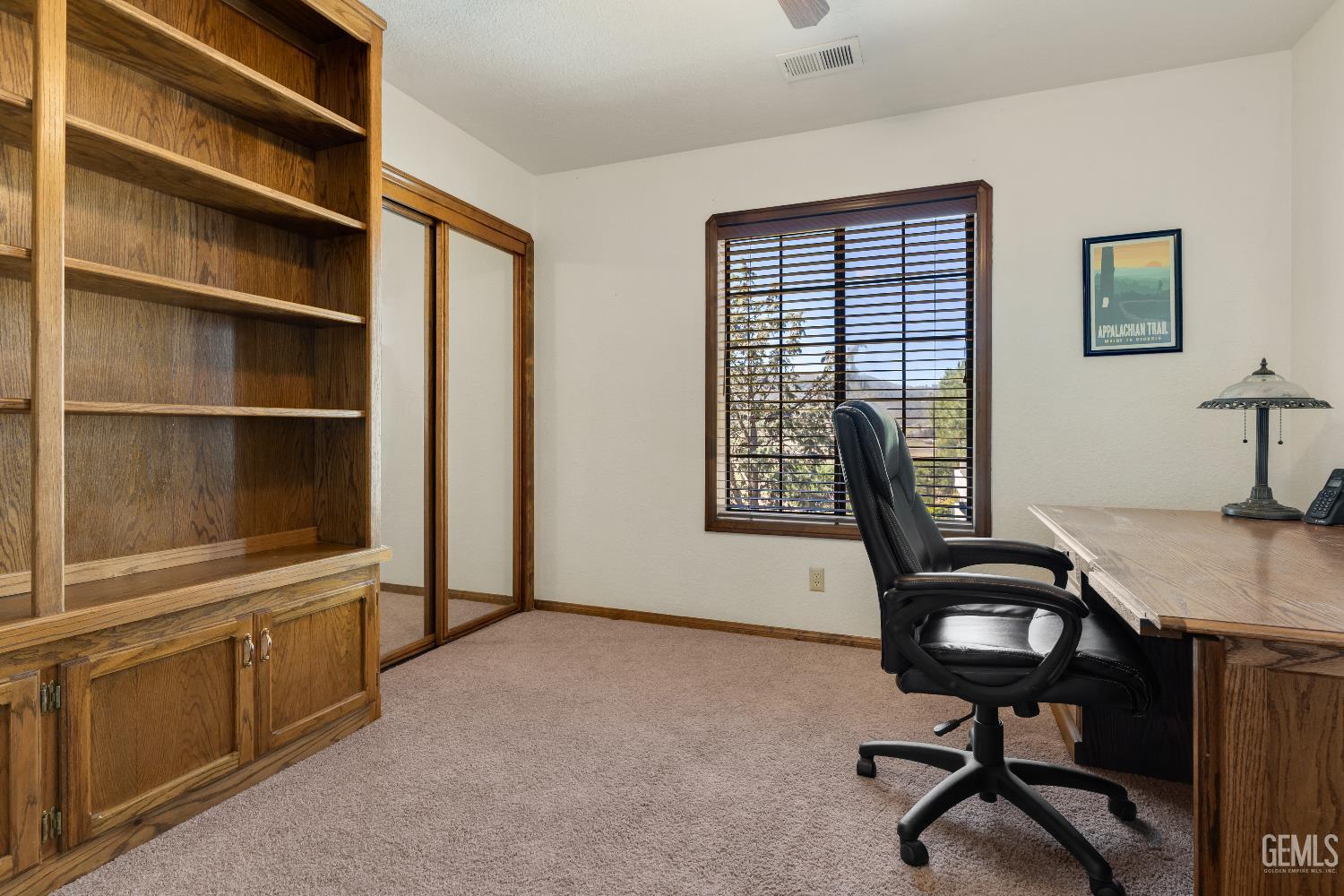 Undisclosed Address Tehachapi, CA 93561 - Photo 23 of 37 a view of a workspace with furniture and a window