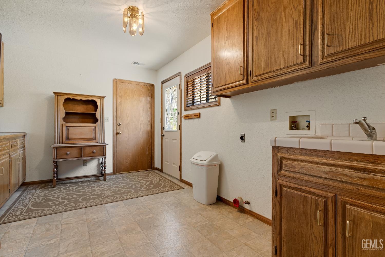 Undisclosed Address Tehachapi, CA 93561 - Photo 24 of 37 a kitchen with stainless steel appliances a refrigerator and cabinets