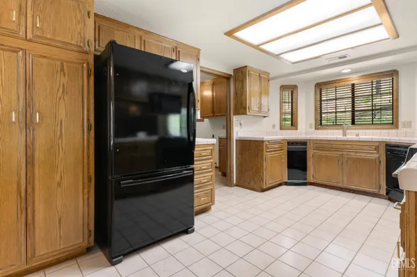 a kitchen with stainless steel appliances a sink and a stove