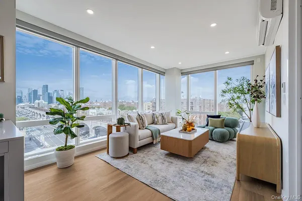 a living room with furniture and a large window
