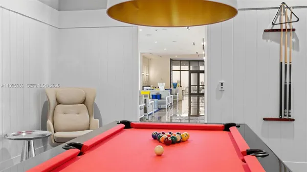 a bedroom with a bed and glass table