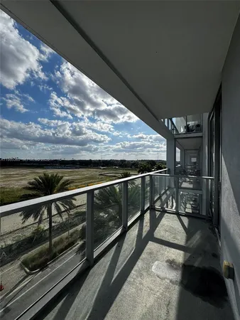 a view of outdoor space with wooden floor
