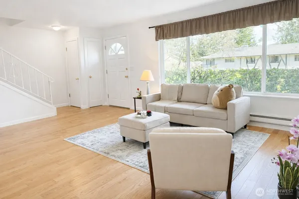 a living room with furniture and a large window
