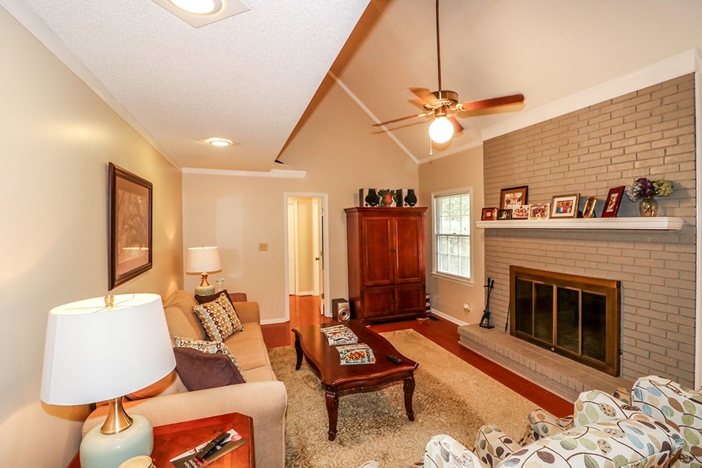 1921 Northside Road Perry, GA 31069 - Photo 11 of 49 a living room with furniture a flat screen tv and a fireplace