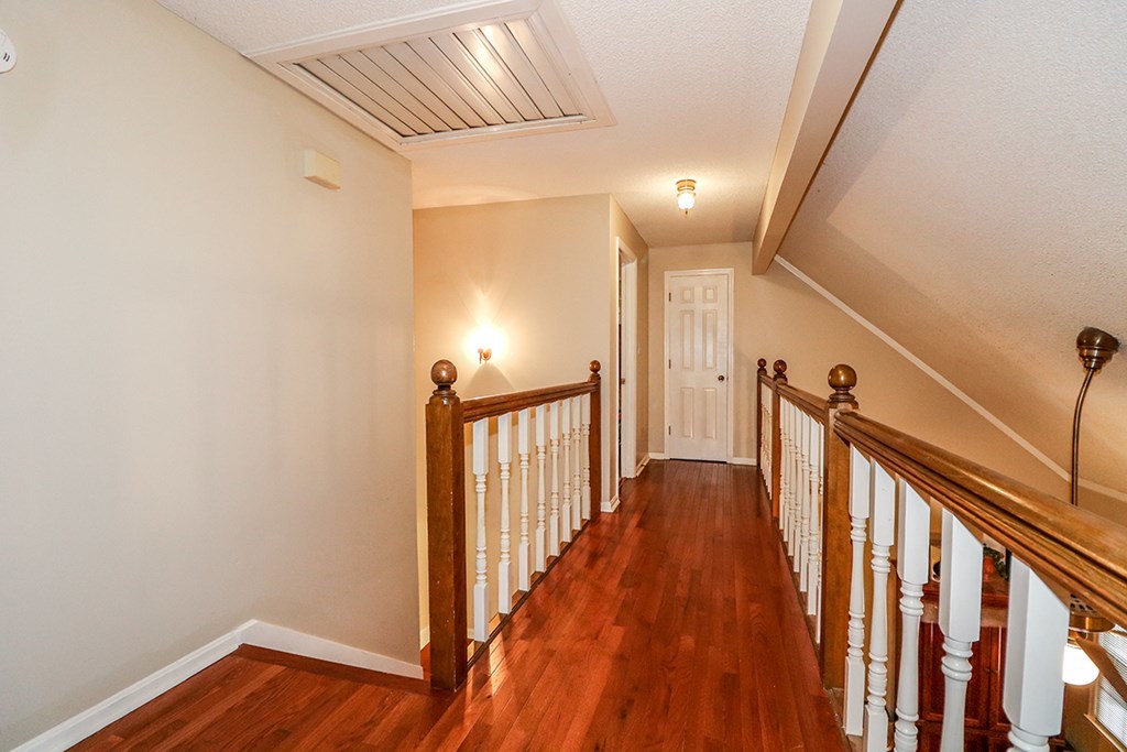 1921 Northside Road Perry, GA 31069 - Photo 13 of 49 a view of a hallway with wooden floor and staircase