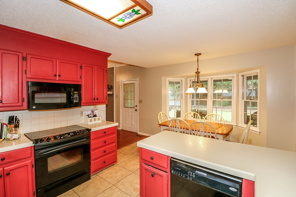 1921 Northside Road Perry, GA 31069 - Photo 15 of 49 a kitchen that has a stove and a microwave