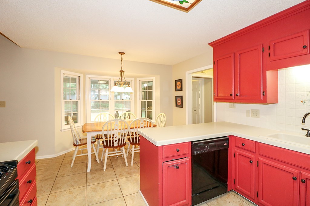 1921 Northside Road Perry, GA 31069 - Photo 16 of 49 a kitchen with a stove a sink and a refrigerator