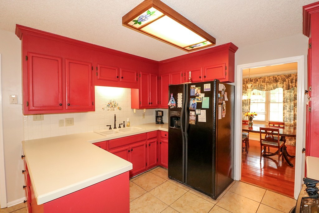 1921 Northside Road Perry, GA 31069 - Photo 17 of 49 a kitchen with stainless steel appliances granite countertop a refrigerator a sink and dishwasher