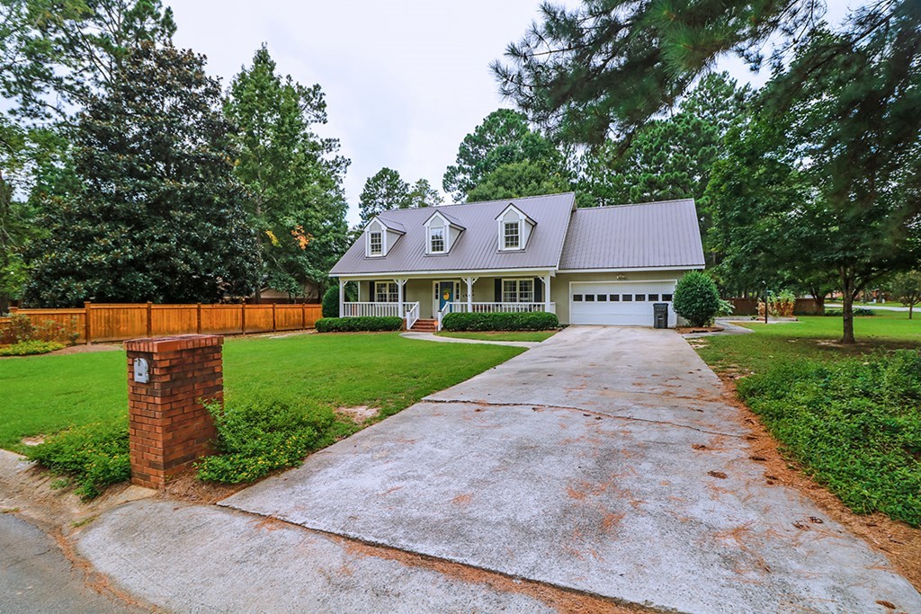 1921 Northside Road Perry, GA 31069 - Photo 3 of 49 a front view of a house with a yard