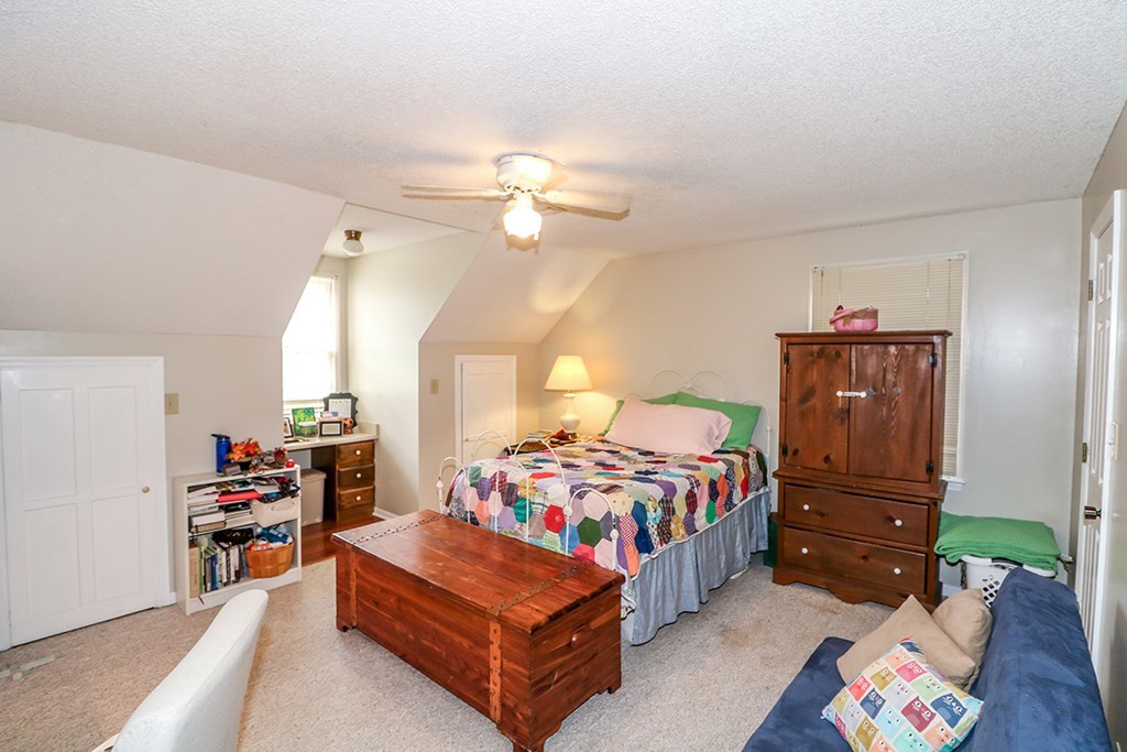 1921 Northside Road Perry, GA 31069 - Photo 22 of 49 a bedroom with a bed and a chandelier