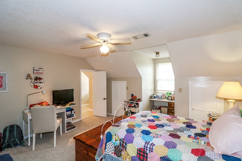 1921 Northside Road Perry, GA 31069 - Photo 23 of 49 a bedroom with a bed and flat screen tv