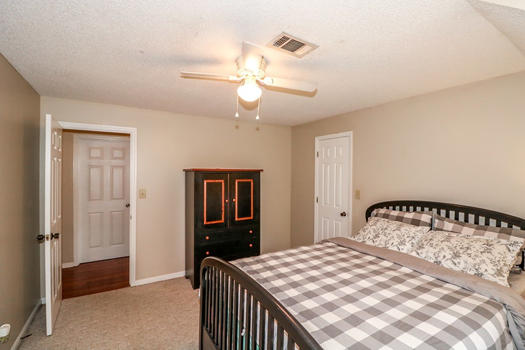 1921 Northside Road Perry, GA 31069 - Photo 28 of 49 a bedroom with a bed and dresser