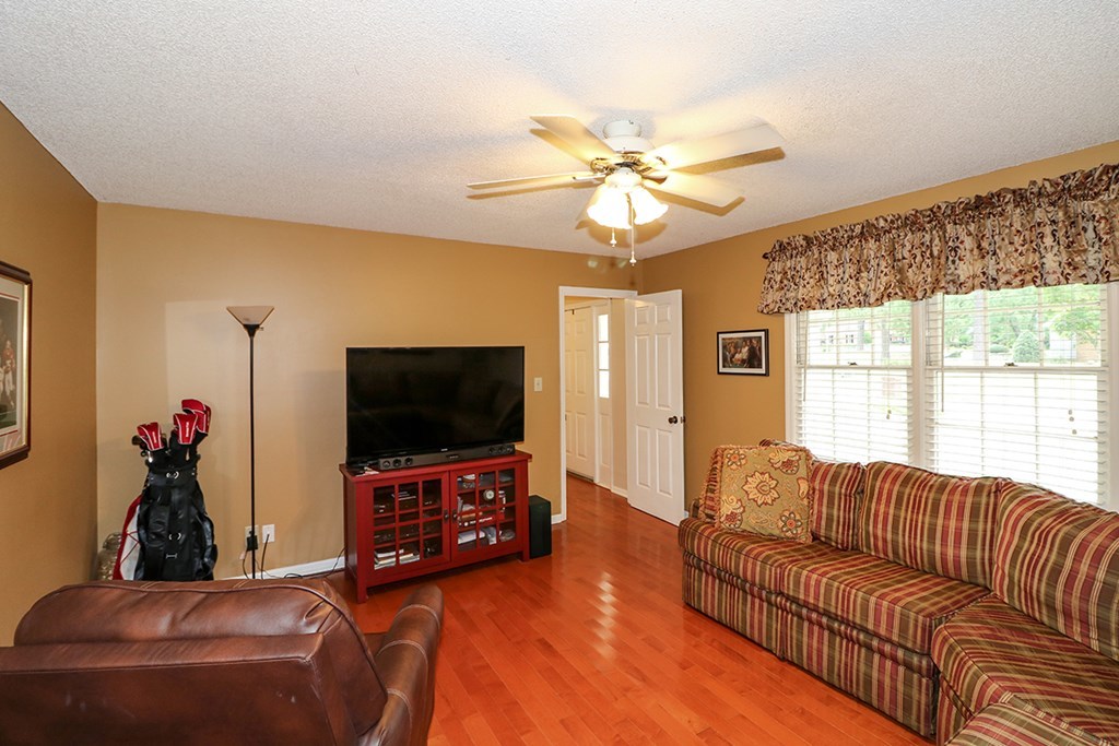 1921 Northside Road Perry, GA 31069 - Photo 33 of 49 a living room with furniture and a flat screen tv