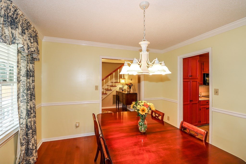 1921 Northside Road Perry, GA 31069 - Photo 37 of 49 a dining room with a chandelier