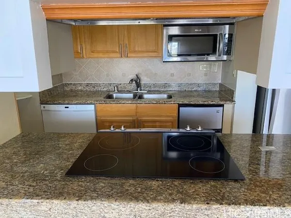 a kitchen with a stove and a microwave