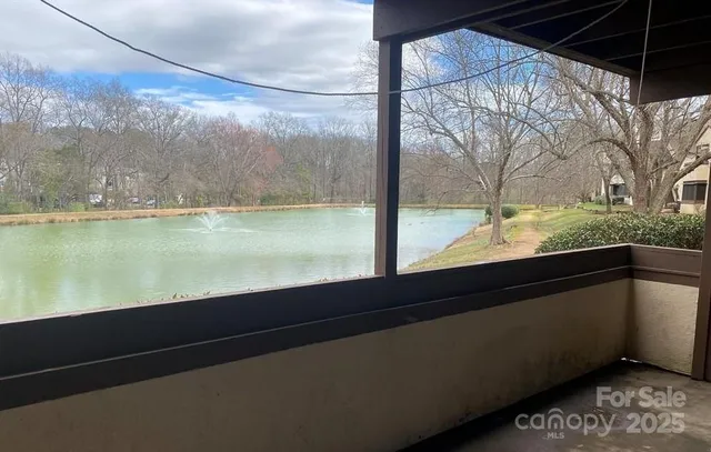 a view of kitchen with stainless steel appliances wooden floor