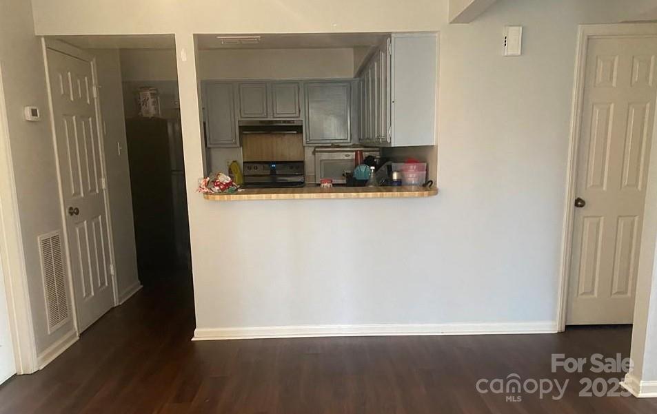 5718 Dockside Drive Charlotte, NC 28227 - Photo 4 of 5 a view of kitchen with stainless steel appliances wooden floor