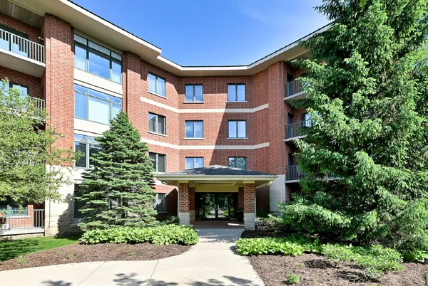 a front view of a building with garden