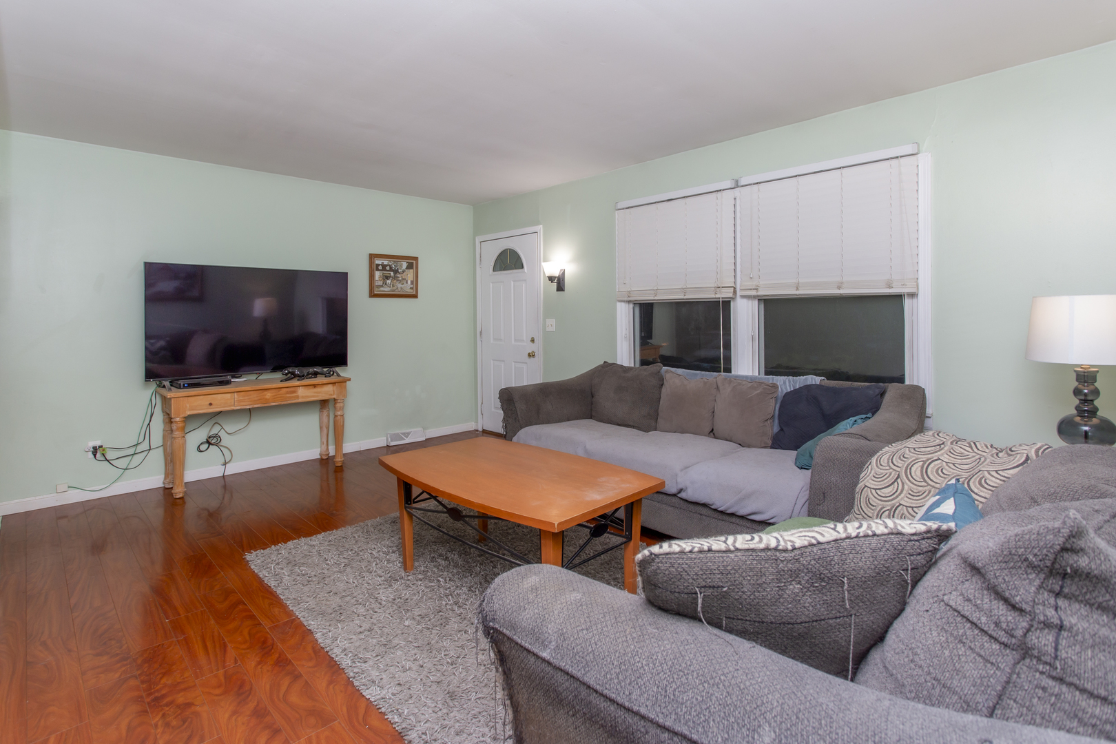 320 Hillside Road New Lenox, IL 60451 - Photo 3 of 14 a living room with furniture and a flat screen tv