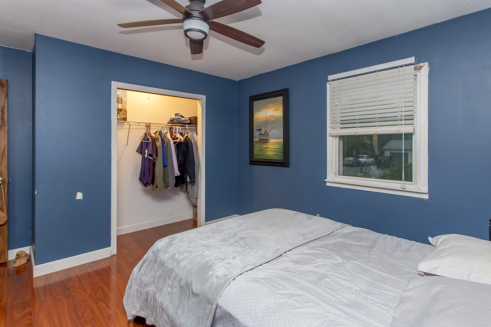 320 Hillside Road New Lenox, IL 60451 - Photo 7 of 14 a bedroom with a bed and a chandelier