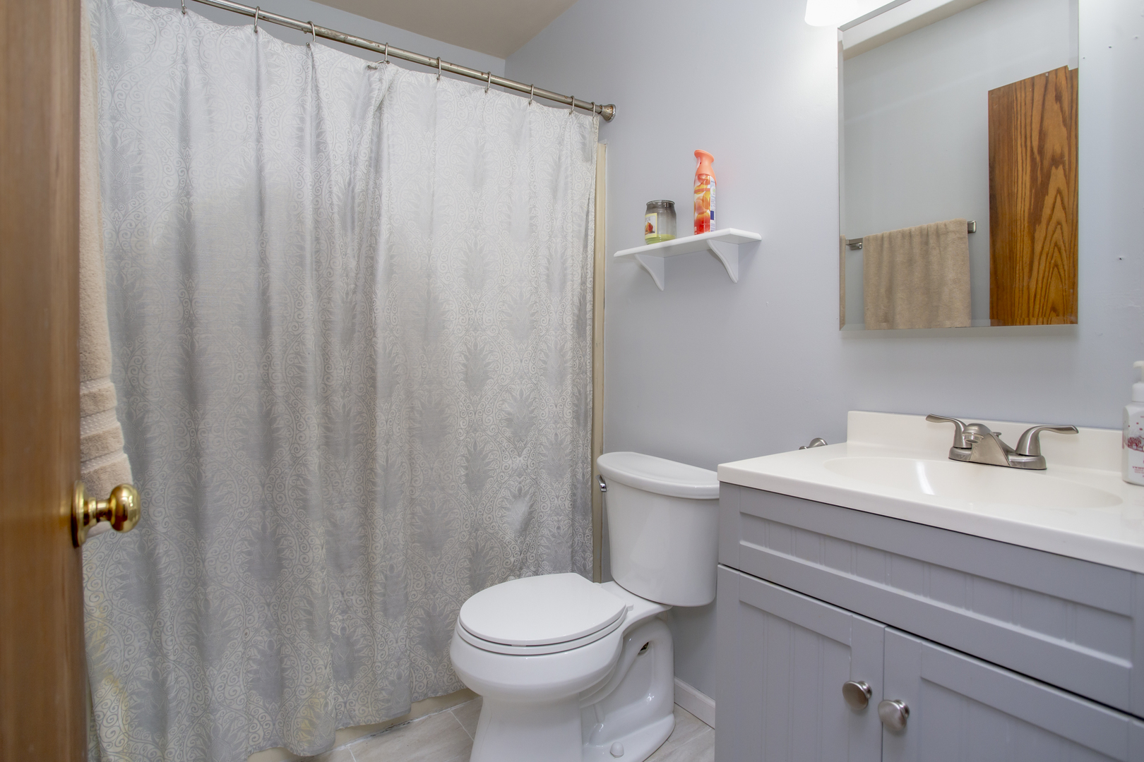 320 Hillside Road New Lenox, IL 60451 - Photo 9 of 14 a bathroom with a toilet sink and shower curtain