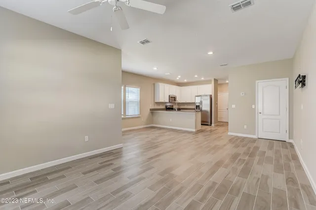 a view of kitchen with wooden floor